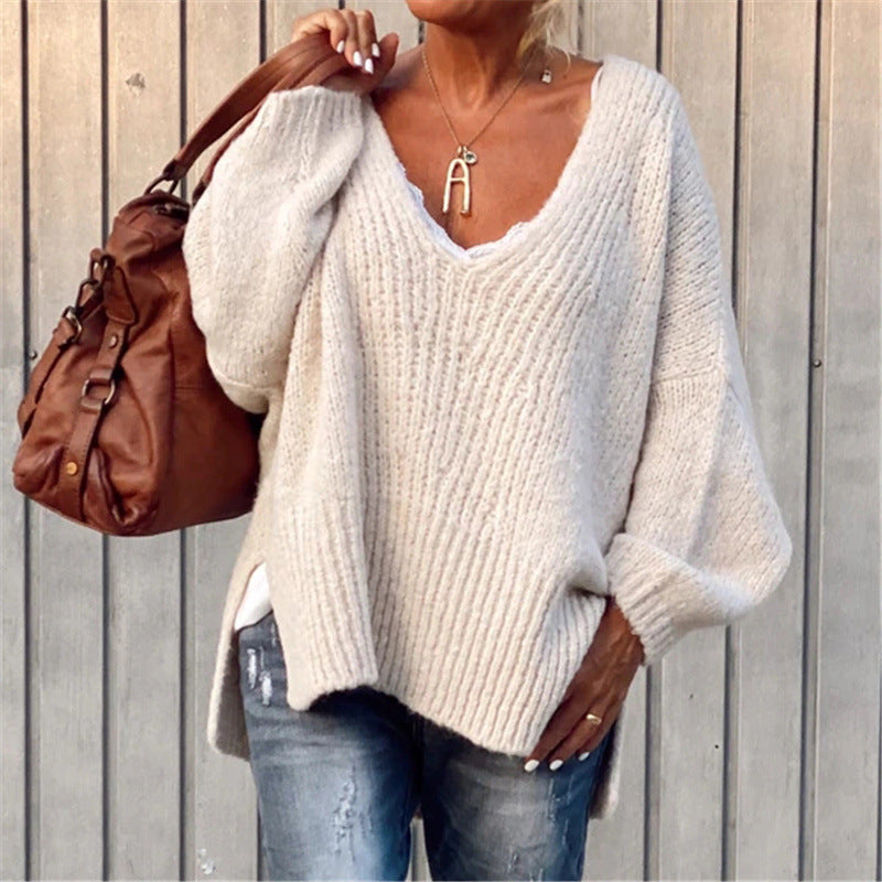 V-neck knitted sweater with side slits